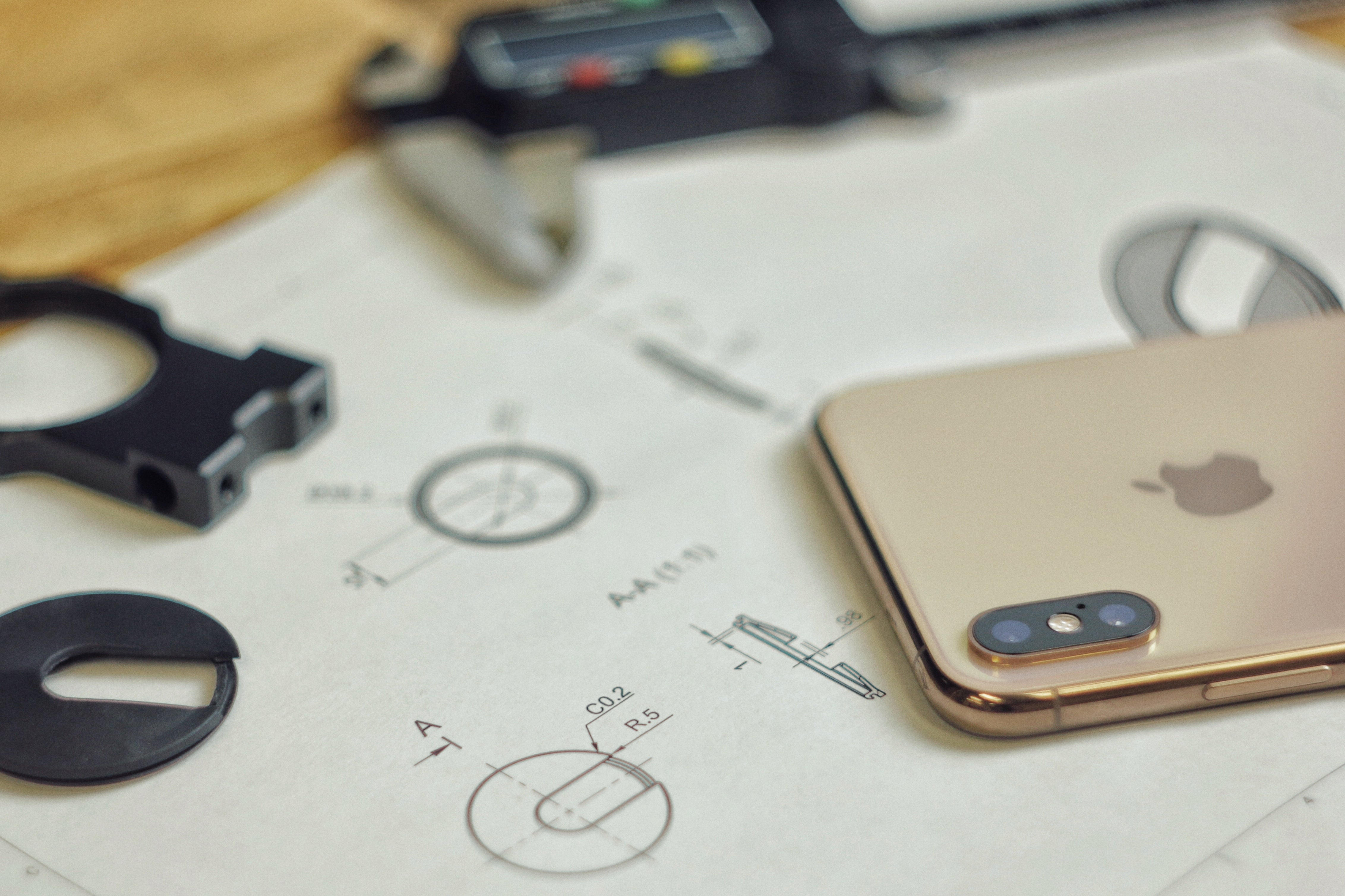 iPhone XS next to Beastgrip Pro rubber insert sketches