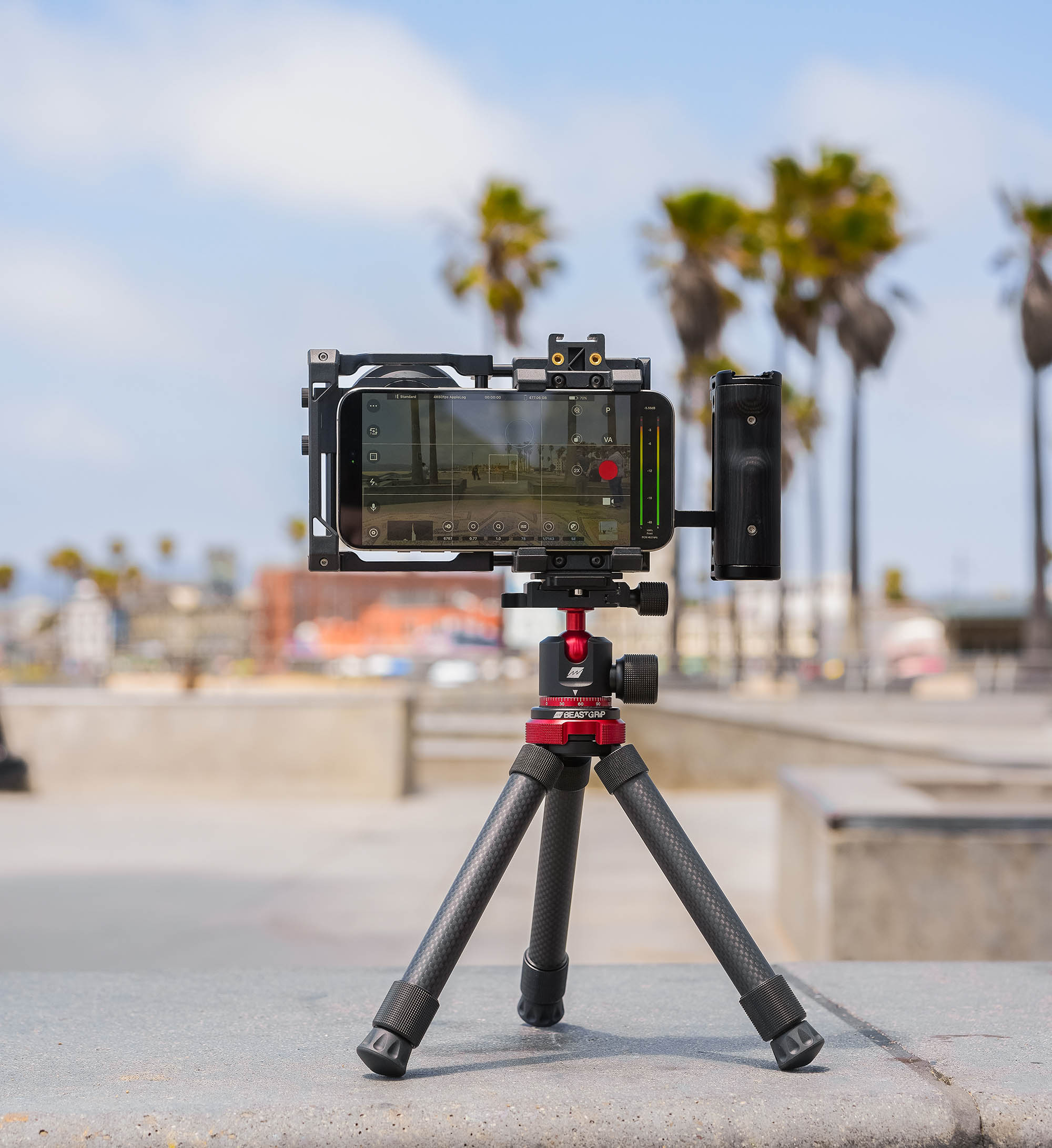 Outdoor shot of Beastgrip BT-60 tripod with Beastgrip Pro rig, iPhone, and side handle for mobile filmmaking and photography