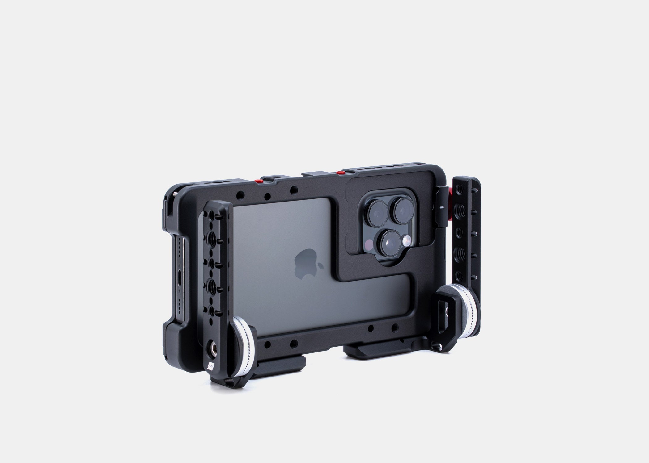 Studio shot of Beastgrip RT and LT Mounts attached to the bottom of the Beastcage for iPhone 16 Pro or 16 Pro Max, configured as front-facing mounts — compatible with handles using NATO rail or ARRI rosette connections for full rig customization