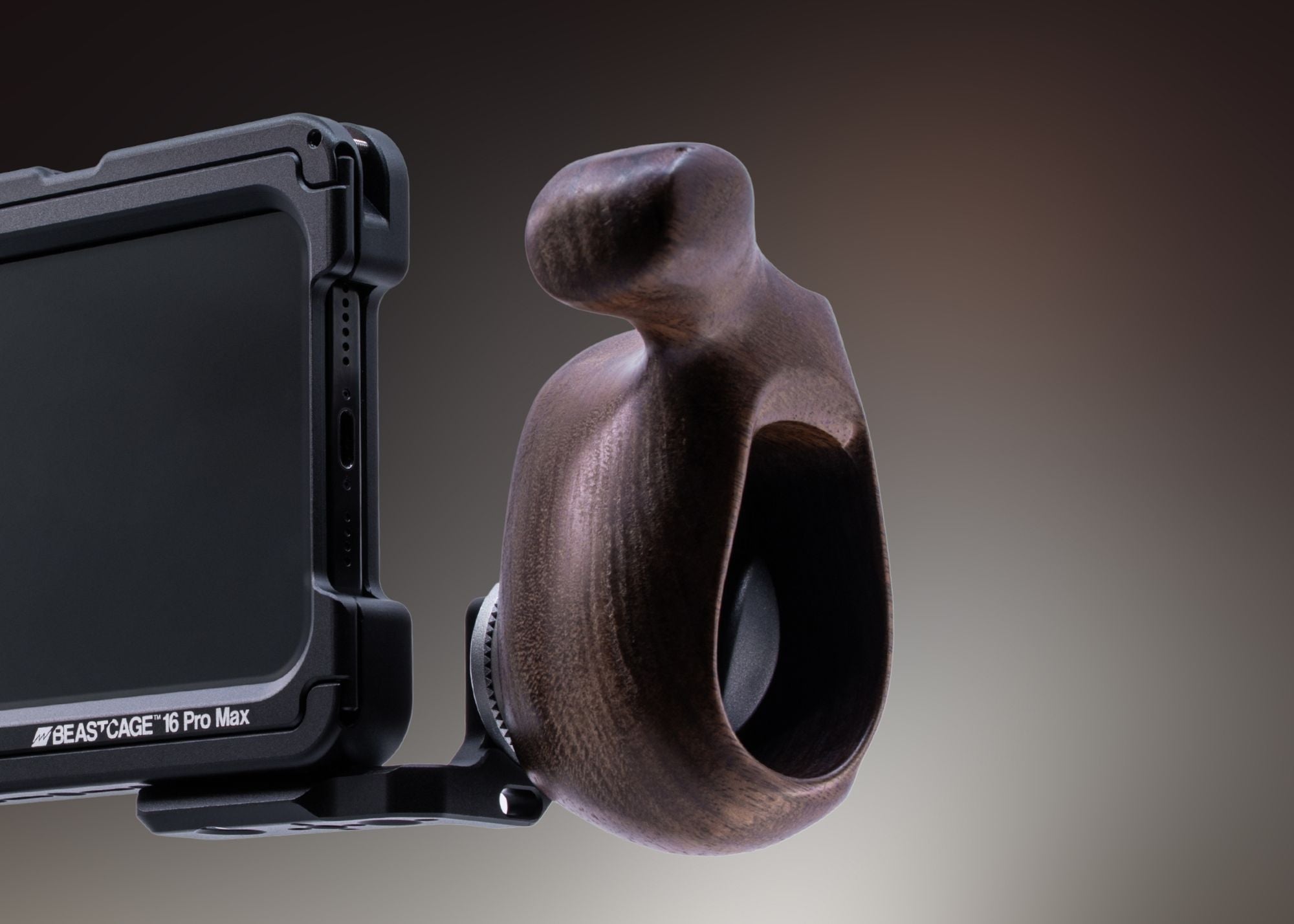 Studio shot of Beastgrip RT Mount attached to Beastcage for iPhone 16 Pro or 16 Pro Max, with ARRI rosette handle mounted — modular setup for professional mobile rig customization.
