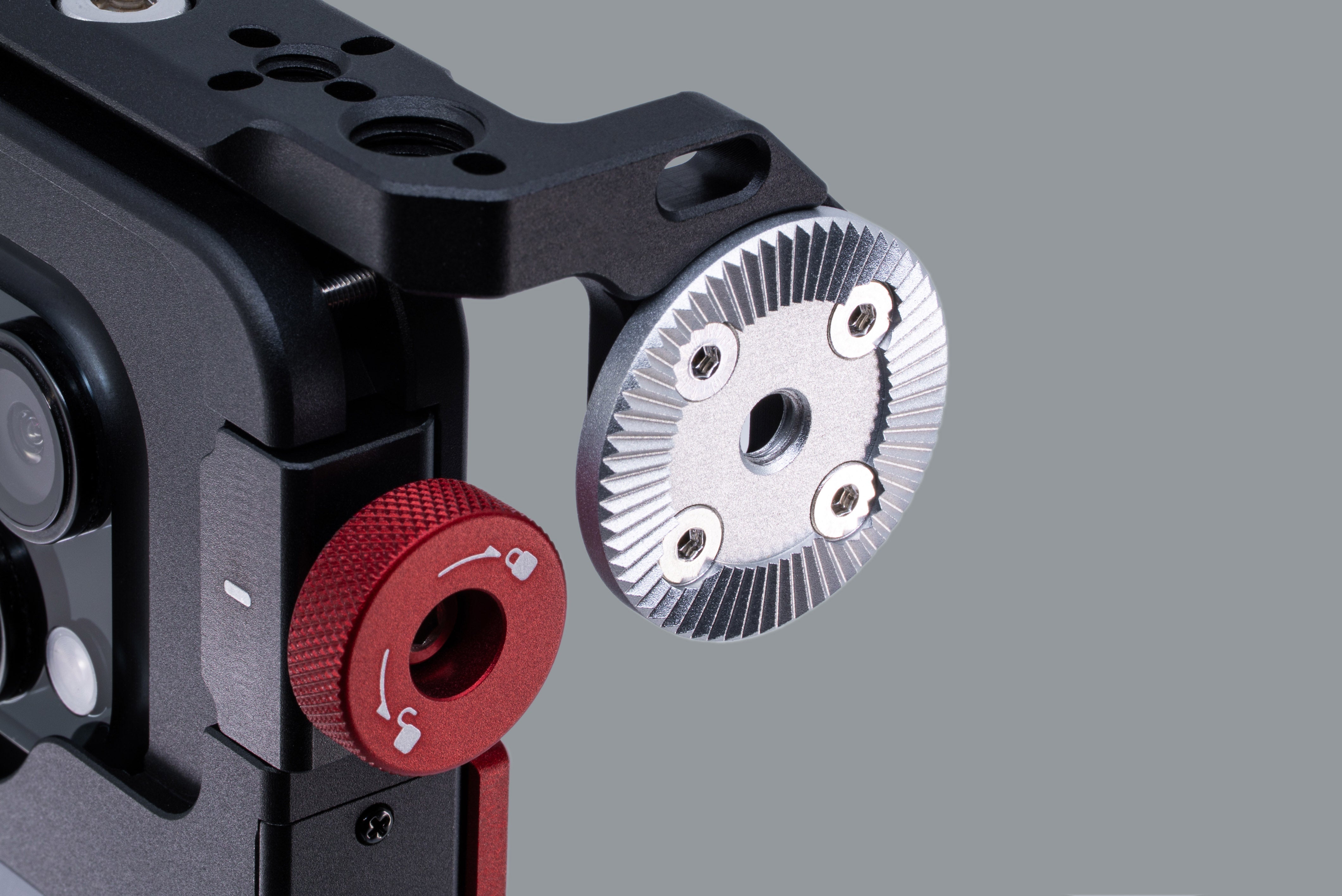 Close-up studio shot of Beastgrip RT Mount attached to Beastcage with NATO rail removed, revealing the ARRI rosette mount — highlighting professional accessory compatibility.