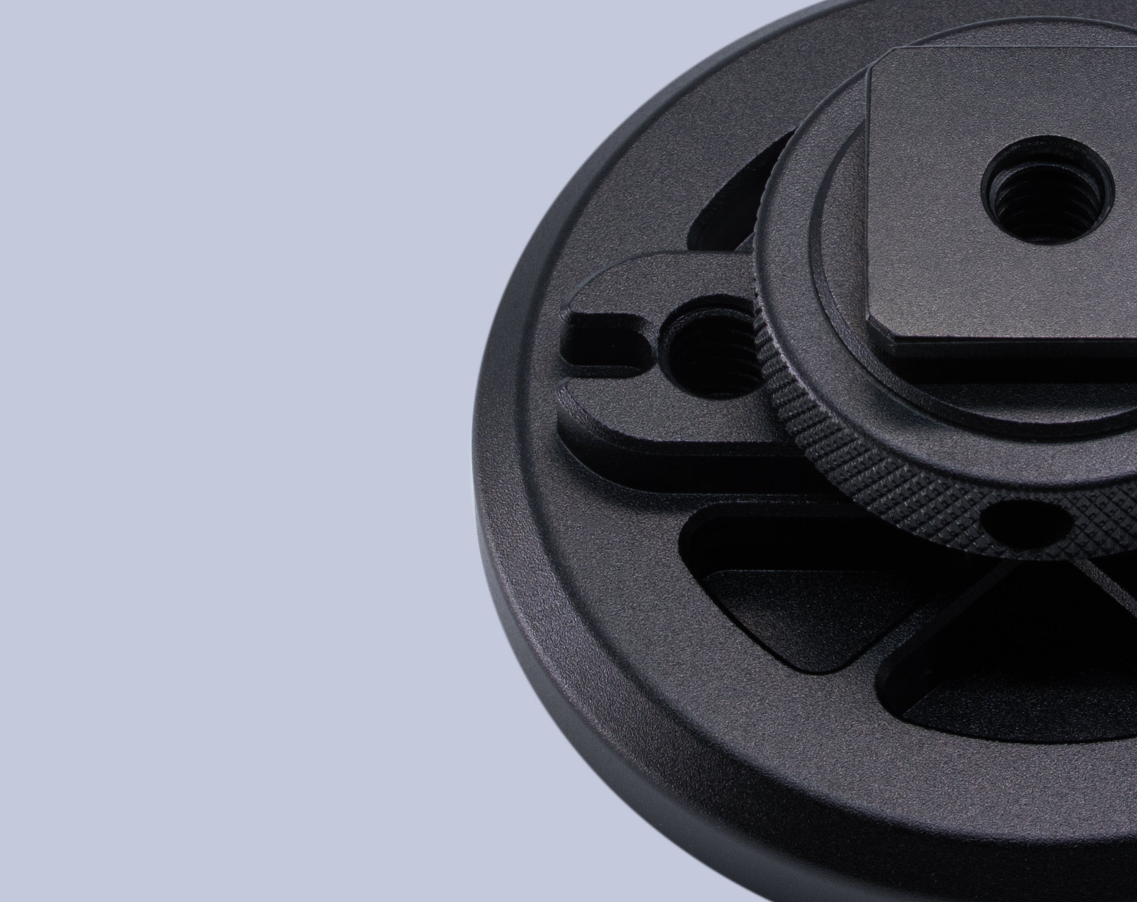 Close-up of the back side of the Beastgrip Magnetic Mount for MagSafe accessories, showing machined aluminum body with anodized finish, cold shoe mount, and ¼"-20 mounting points