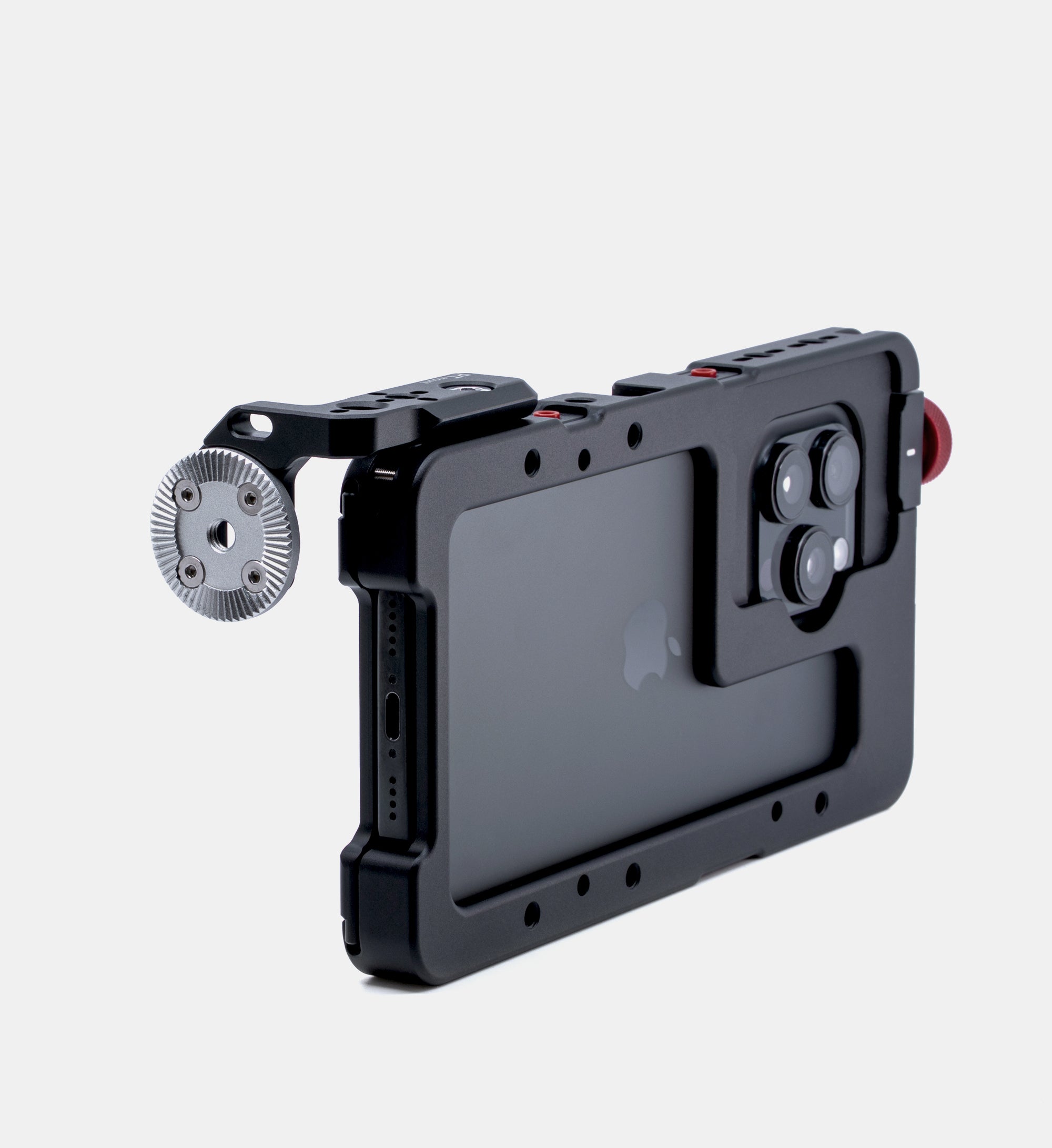 Beastgrip RT Mount attached to Beastcage for iPhone 16 Pro or 16 Pro Max with NATO rail removed, exposing ARRI rosette mount — versatile handle mounting solution for professional mobile rigs.