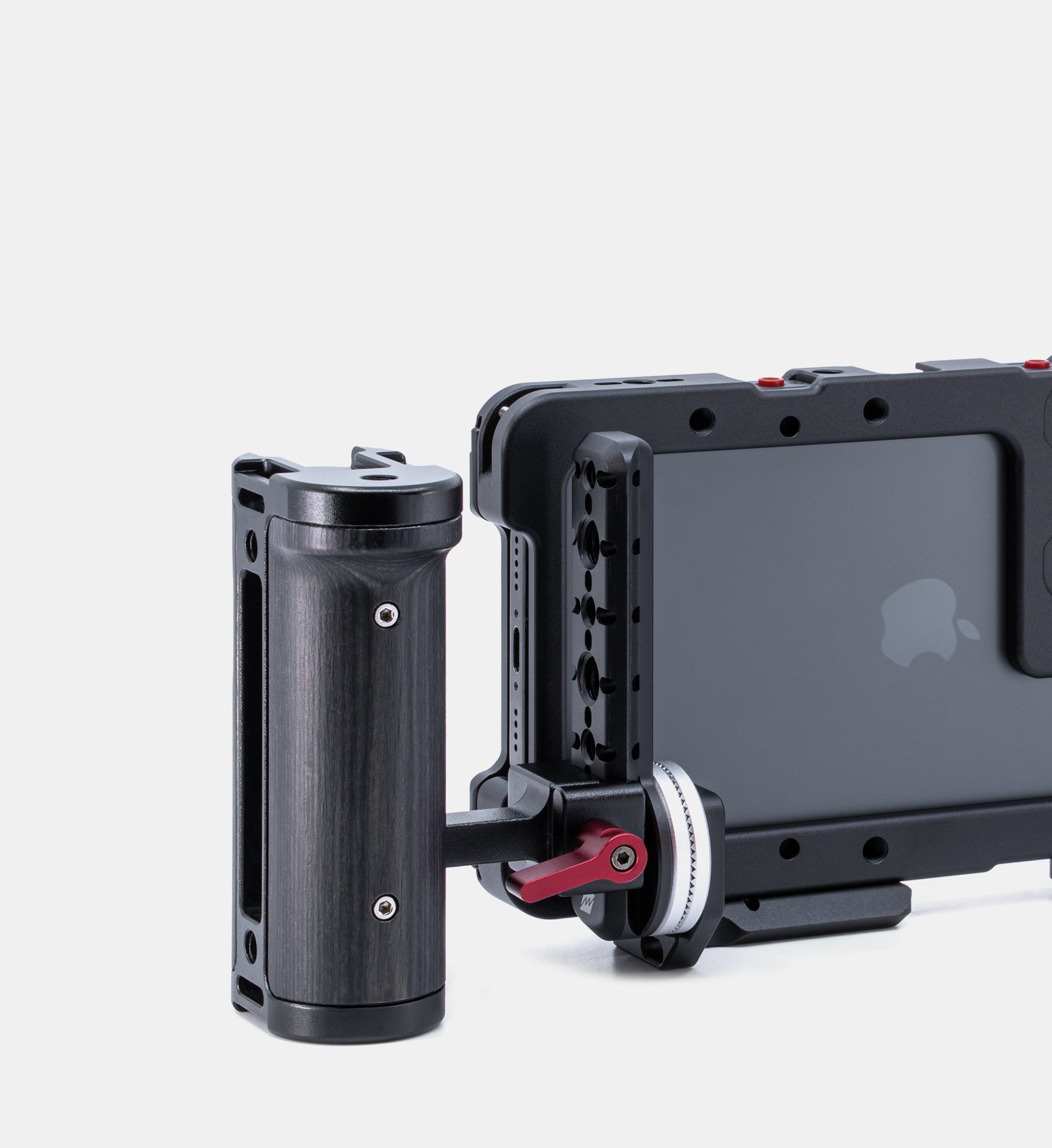Close-up of Beastgrip RT Mount facing forward on bottom of Beastcage for iPhone 16 Pro or 16 Pro Max, with Beastgrip side handle attached — compact and customizable rig configuration for mobile creators.