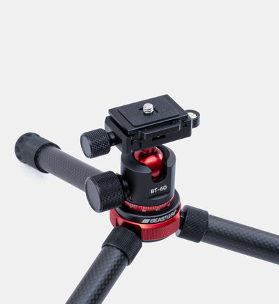 Semi-closeup angled view of Beastgrip BT-60 tripod showcasing carbon fiber and  machined aluminum build for iPhone and Android filmmaking and photography