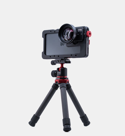 Studio shot of Beastgrip BT-60 tripod with Beastcage and 1.7x telephoto lens for iPhone filmmaking and photography 