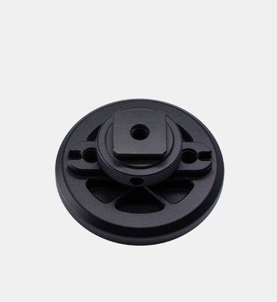 Top view of the back side of the Beastgrip Magnetic Mount for MagSafe accessories showing aluminum build with anodized black finish, cold shoe mount, and multiple ¼"-20 threaded mounts