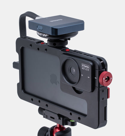 Studio shot of SanDisk CFexpress MagSafe card reader on Beastgrip Magnetic Mount with T-Bracket on Beastcage for iPhone mounted to Beastgrip BT-60 tripod.