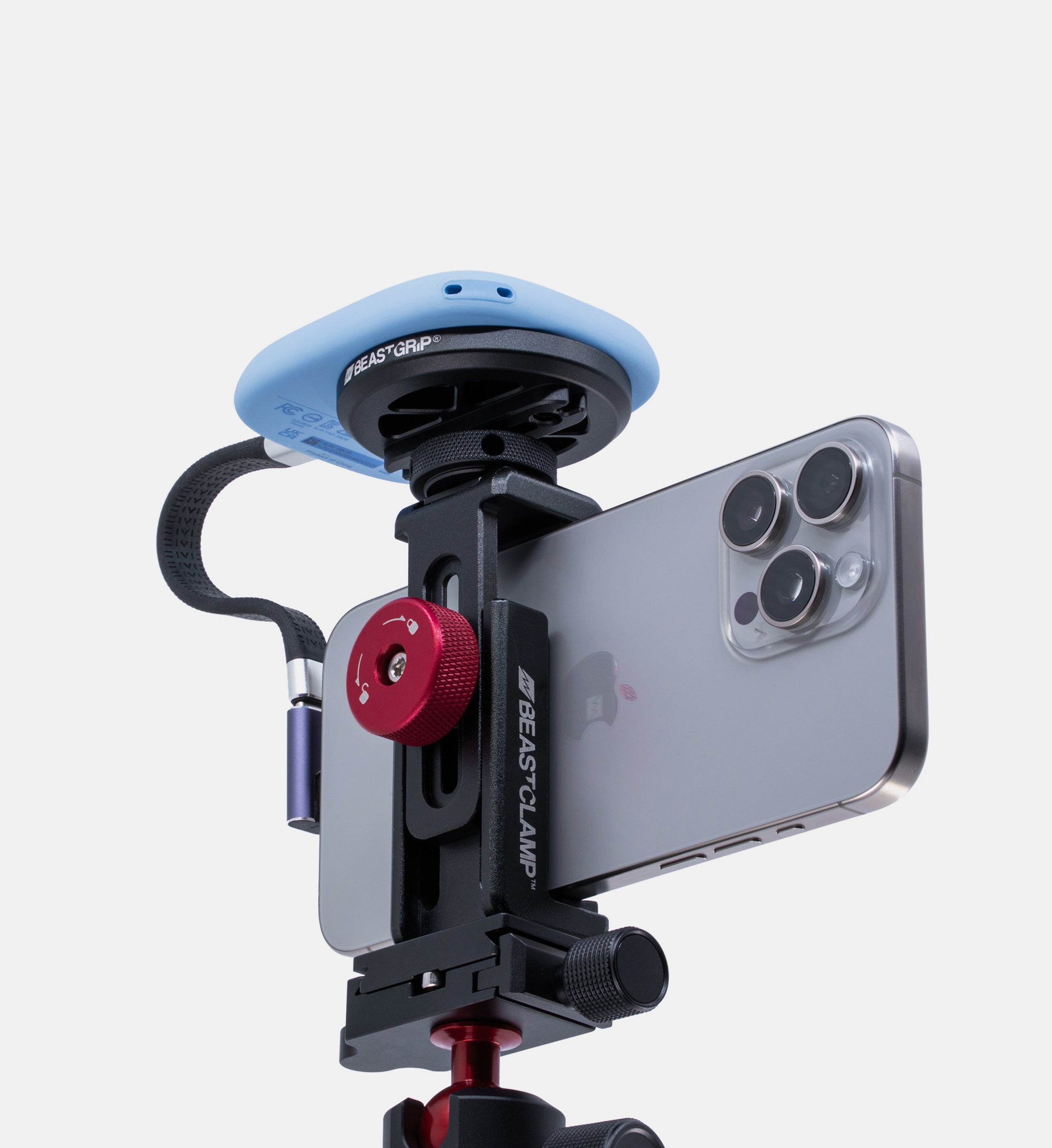 Studio shot of Beastclamp iPhone camera rig with MagSafe Magnetic Mount holding a SanDisk SSD drive, all mounted on the Beastgrip BT-60 mini tripod