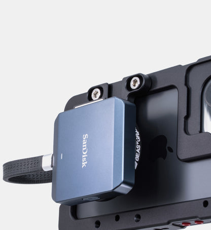 Studio close-up of SanDisk CFexpress card reader attached via MagSafe to Beastgrip Magnetic Mount with T-Bracket on Beastcage for iPhone