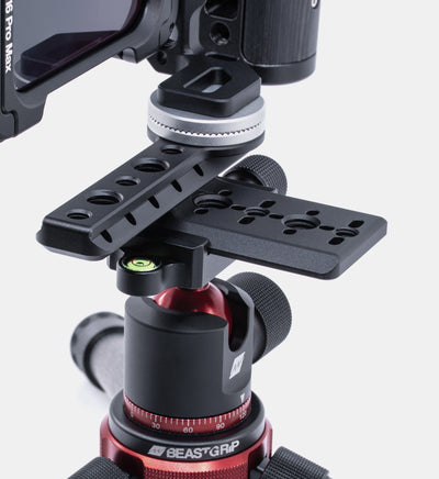Close-up of Beastgrip Quick Release Plate mounted to Beastcage via RT Mount, with rig secured vertically on tripod — vertical iPhone filmmaking setup for reels and mobile content.