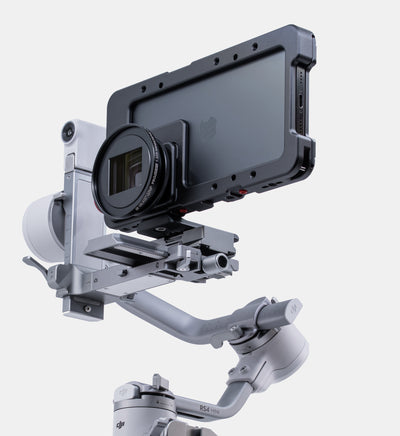 Beastgrip Quick Release Plate mounted on Beastcage 16 Series with 1.33X anamorphic lens, balanced on DJI gimbal — mobile filmmaking rig for stabilized cinematic shots.