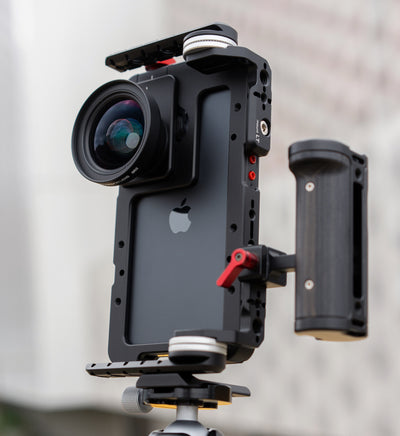 Beastcage 16 Pro Max rig in vertical orientation with Beastgrip LT and RT Mounts attached at the bottom, side handle mounted for vertical grip, and 0.75X wide-angle lens — secured to tripod via Beastgrip quick-release plate for mobile content creation.